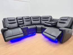 Luxury Black Leather    Sofa with Bluetooth Speakers & Wireless Charging for Smartphone Audio Fabric