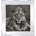 A regal lioness wearing a crown, surrounded lovingly by her cubs