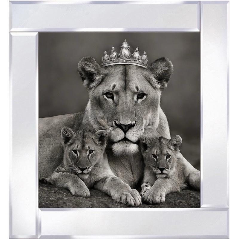 A regal lioness wearing a crown, surrounded lovingly by her cubs